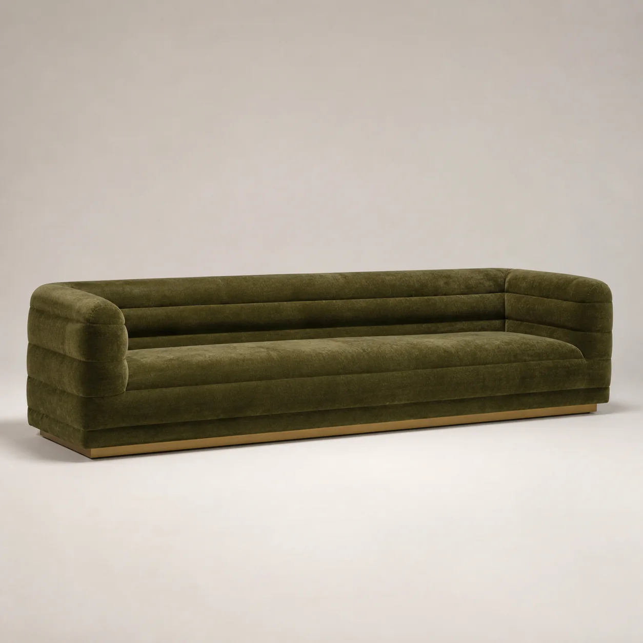 Monaco Channel Sofa studio concept visual in moss velvet, satin brass shadow plinth