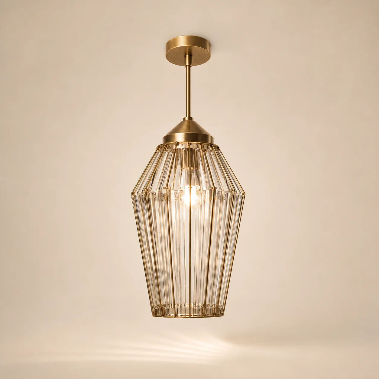 Jewel Ribbed Pendant studio concept visual in warm clear glass, satin brass