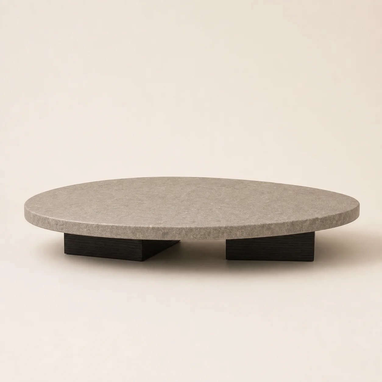 Seki Stone Table studio concept visual in warm-grey stone, charred timber shadow base