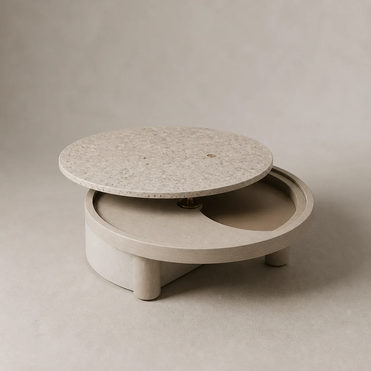 Orbit Stone Tea Table studio concept visual in warm terrazzo, pale ash, patinated bronze pivot