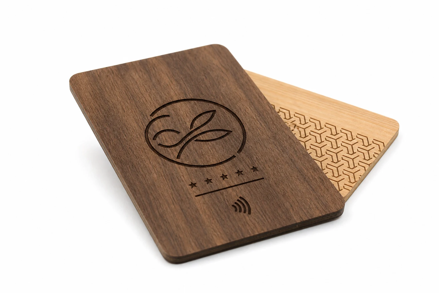 Laser-engraved wooden hotel key cards arranged on a workshop table